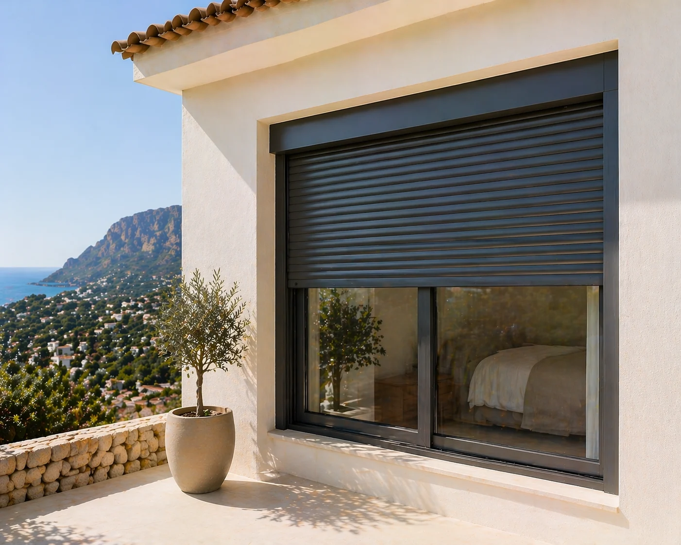 Motorised grey persiana lowered over a glazed opening