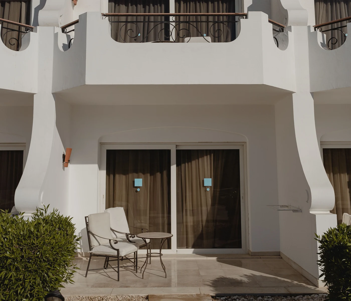 Modern sliding patio doors opening onto a paved terrace